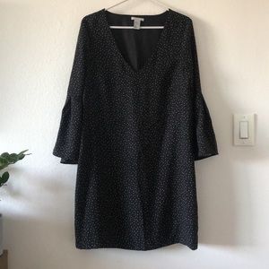 Black dress with flair sleeves. 100% Polyester.